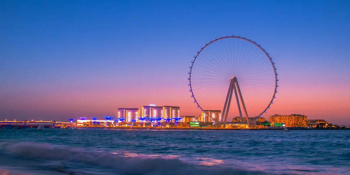Ain Dubai observation wheel at sunset with the Arabian Gulf and JBR waterfront glowing in warm twilight light