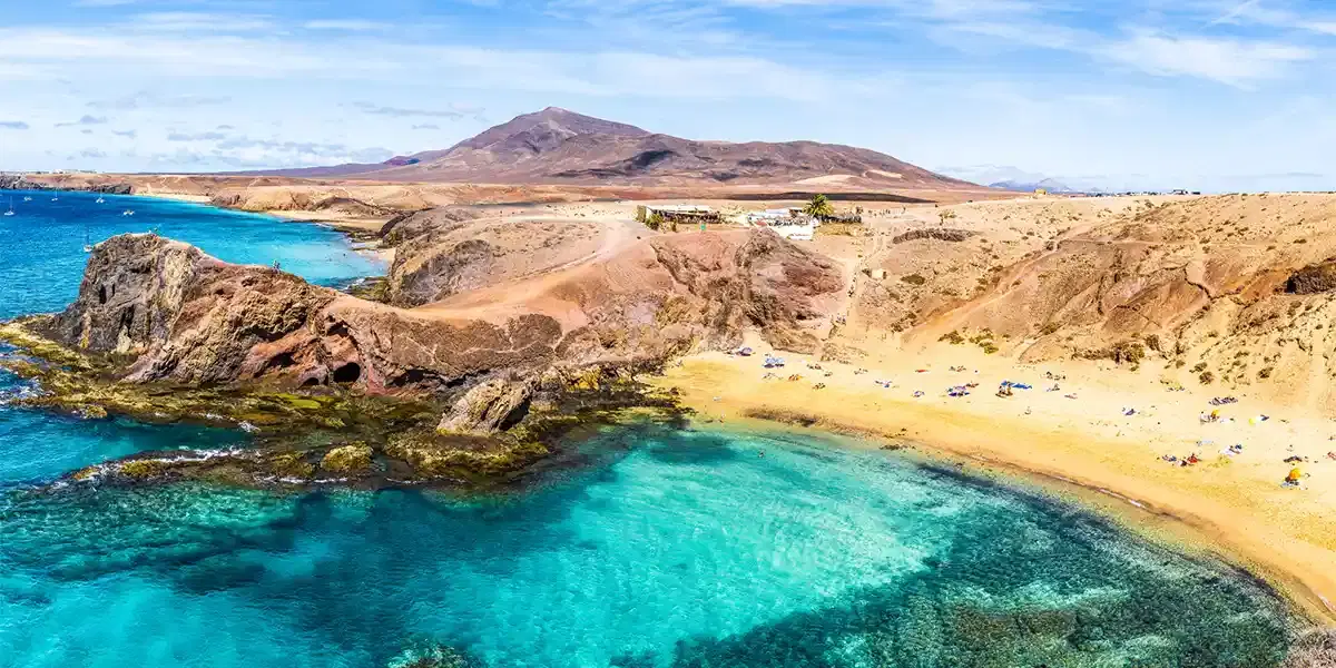 Crystal clear waters and scenic coastline views during a Lanzarote holiday package