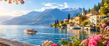 Wooden motorboat cruising across turquoise Lake Como with colourful Italian villas and Alpine mountains at golden hour